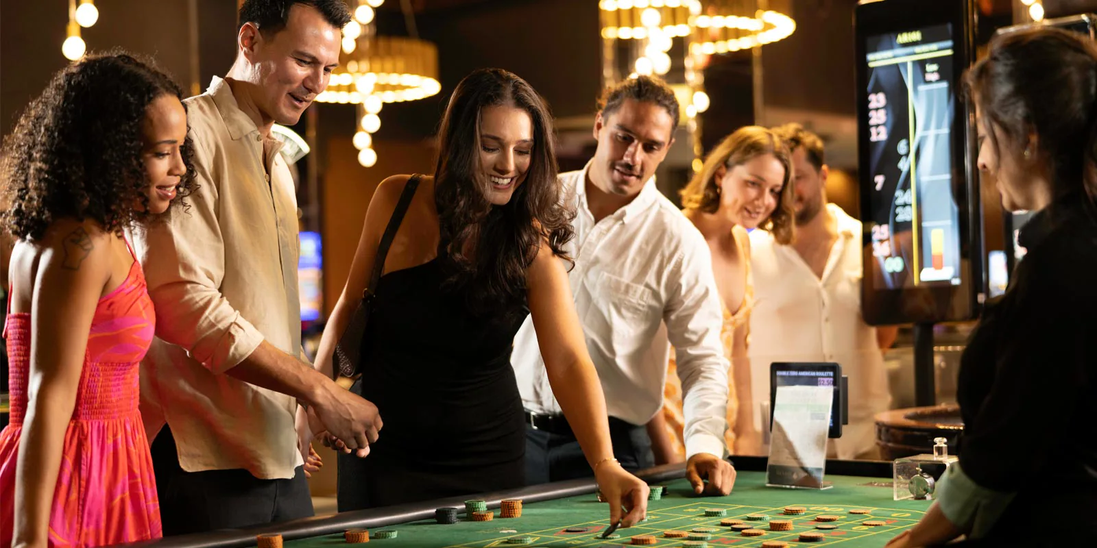 Adult guests at a table inside Mindil Beach Casino Resort
